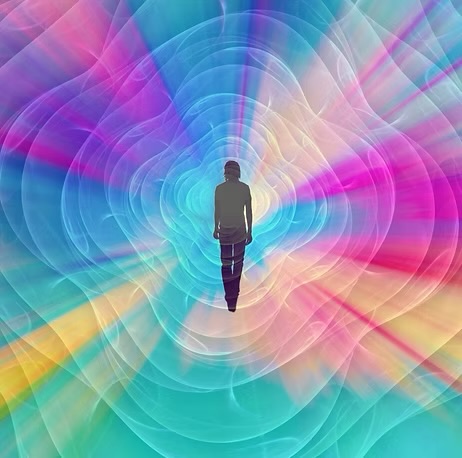 A figure walking into radiating light, for the Emerald Activation and Dimensional Frequency Expansion workshop