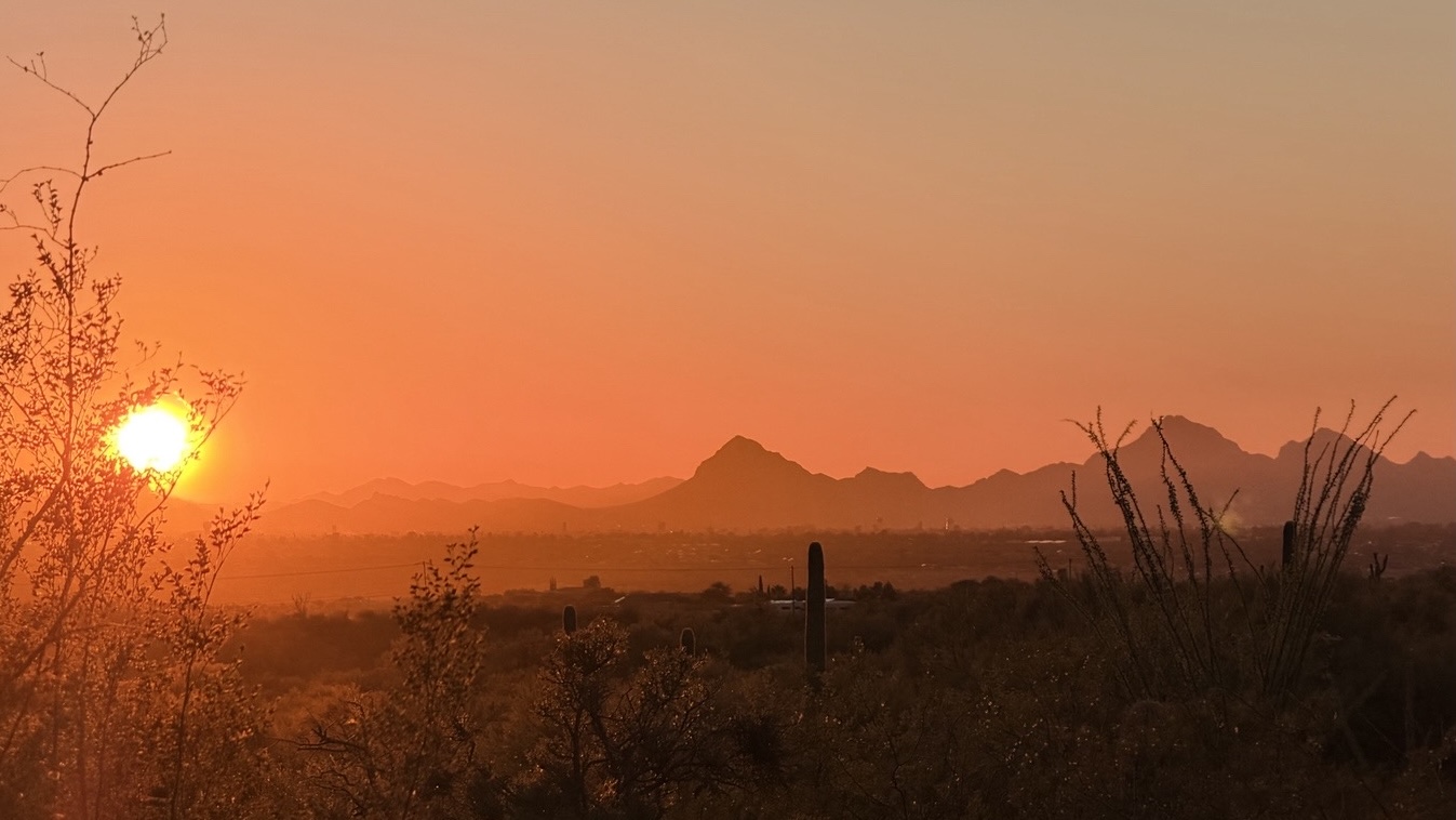 A fall sunset over the mountains and desert at Equinimity